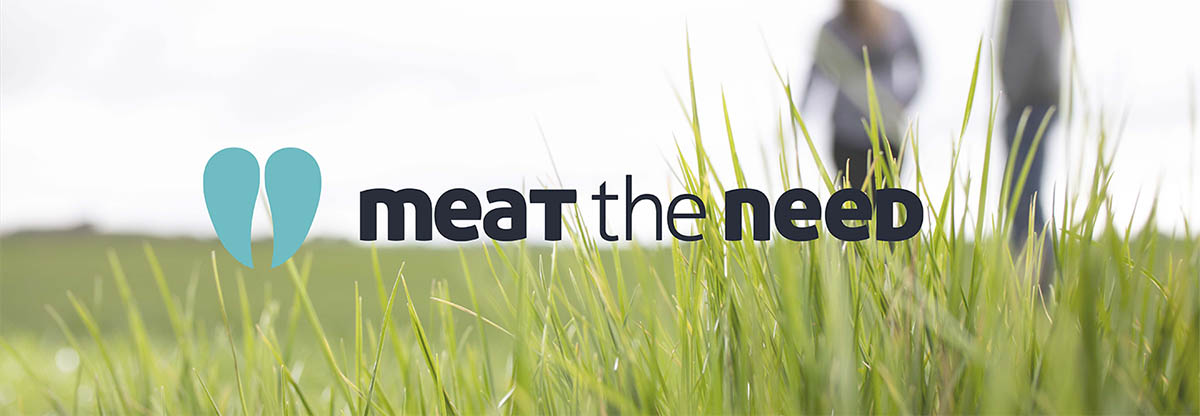 Meat the Need logo over a paddock of ryegrass with 2 people standing in it